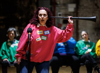 Meg holds an ear trumpet